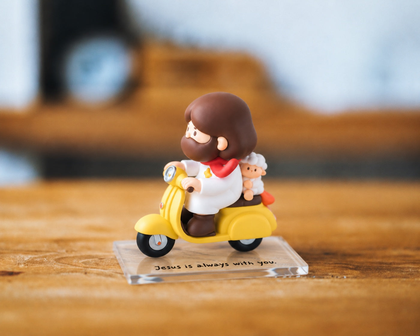 Along for the Journey figurine photographed on a warm wooden tabletop